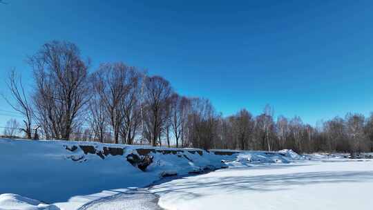 航拍初春库都尔河开河雪景