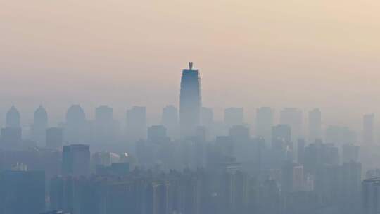 中国河南郑州清晨日出晨雾城市风光航拍