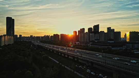 航拍杭州机场城市高架车流夕阳晚霞风光
