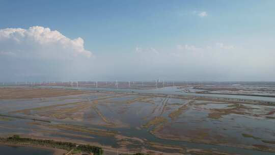 大海海边沙滩风车自然风光蓝天白云航拍