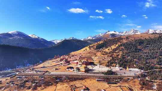 航拍四川甘孜扎西持林寺庙雪山风光