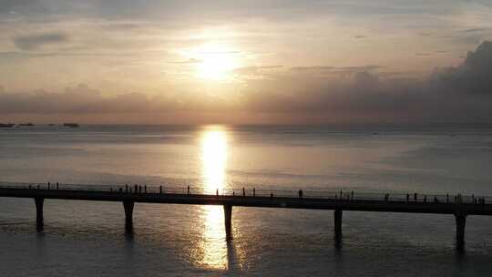 北海海上栈道航拍海边日落晚霞