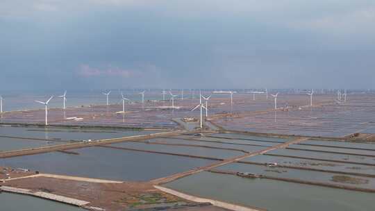 大海海边沙滩风力发电风车航拍