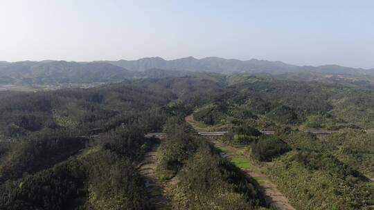 丘陵山川蓝天白云绿色森林航拍