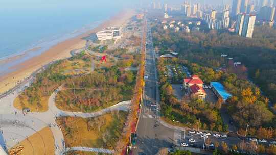 航拍落日晚霞下的烟台时光塔建筑风光全景