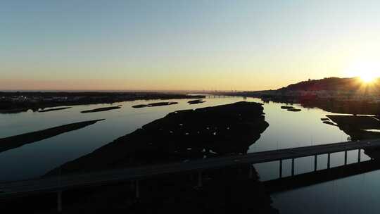 航拍夕阳下的河流视频素材模板下载