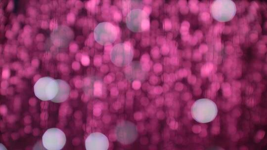 粉红色粒子闪烁模糊背景
