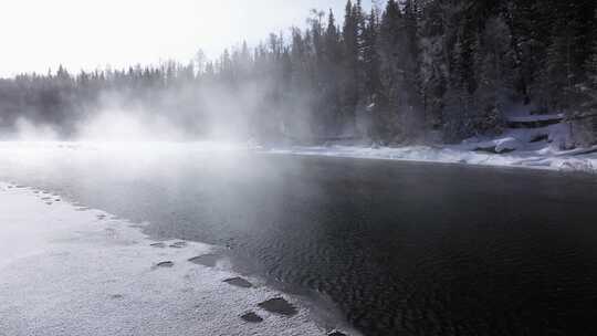 航拍新疆冬季喀纳斯神仙湾晨雾雪山森林雪景