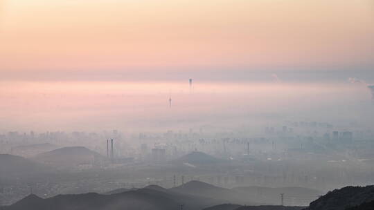 北京西山远眺CBD核心区悬日日出平流雾