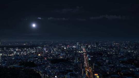 夜晚城市夜景一轮明月升起