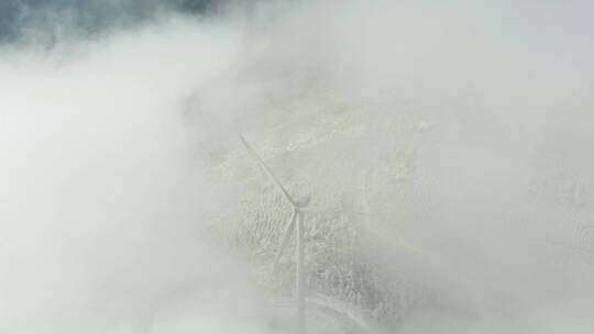 航拍东白山雪后电力风车云海风景