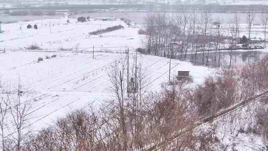 航拍农村乡镇集镇田野平原雪景