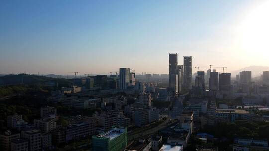 晨曦城市清晨阳光照耀深圳龙岗建筑高楼A