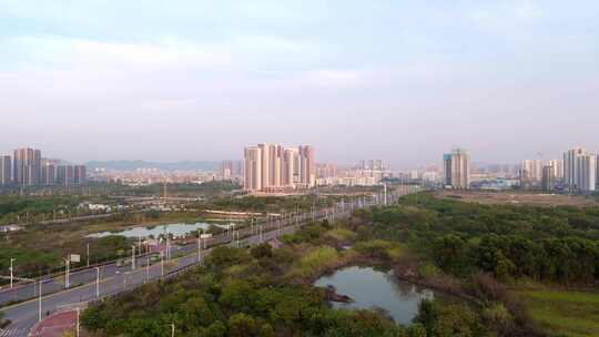 航拍惠州仲恺城市发展中的道路与建筑场景