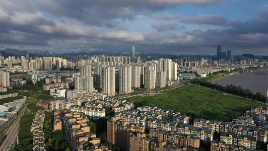 航拍城市雨后烟囱、云、建筑群