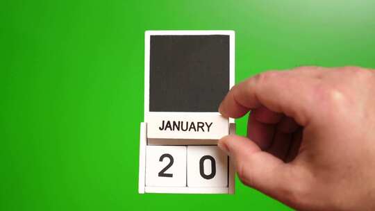 01.绿色背景上日期为1月20日的日历。