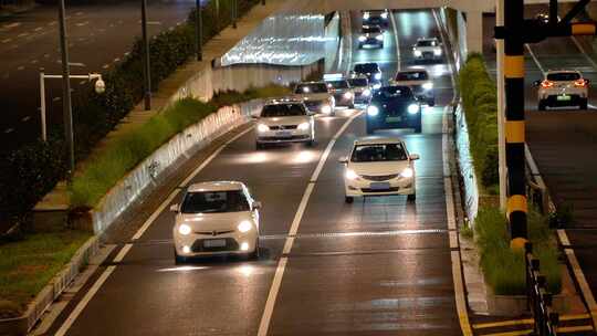 夜晚快速路隧道口车流马路行车亮化