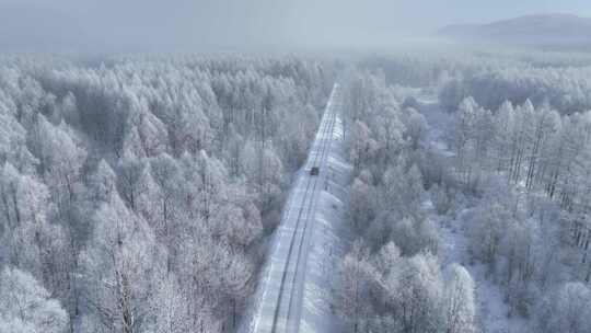 航拍林海雪原雪林和山路