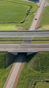 航拍特写修建在乡村平原上的高速公路