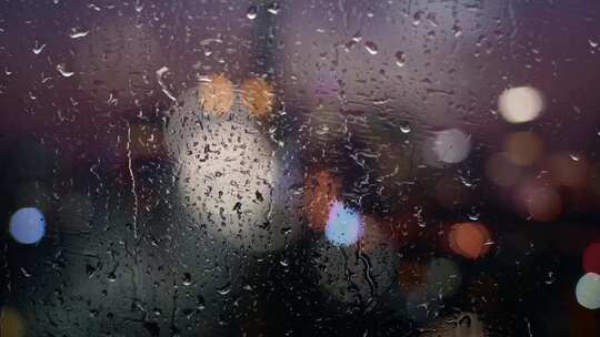 窗户雨滴夜晚城市霓虹光斑视频素材模板下载