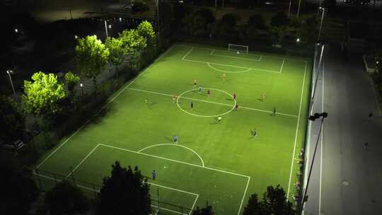 航拍夜晚足球场踢足球比赛视频素材模板下载