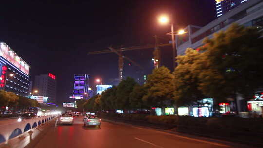 行车拍摄武汉光谷转盘道路及商业街夜景