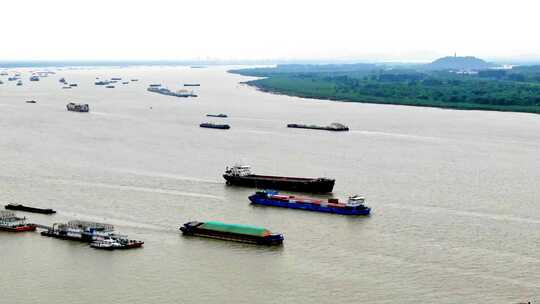航拍轮船货轮航行长江江边堤岸润扬大桥视频素材模板下载