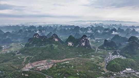 航拍桂林云海下的山峰