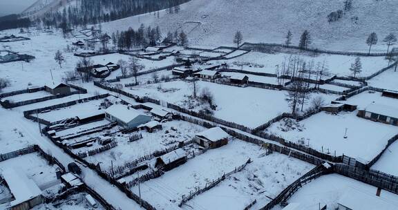 航拍东北林区冬季日暮雪村