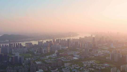 日出晨曦中的杭州滨江城市建筑风景航拍