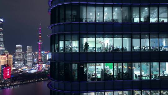 航拍上海商务楼白领加班忙碌夜景视频素材模板下载