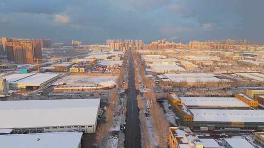 冬季航拍哈尔滨大雪中的城市道路和建筑