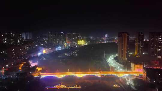 航拍洞县城城市夜空绽放多彩绚烂烟花的景象