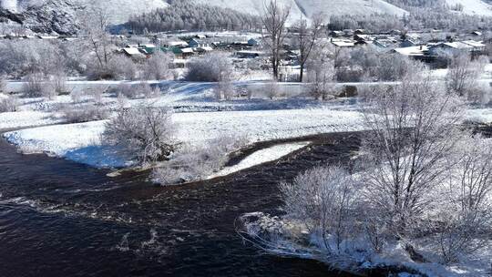 航拍早春雪后的山村银装素裹