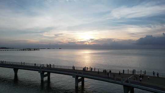 北海海上栈道航拍海边日落晚霞