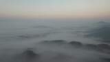 水墨画山川清晨迷雾日出云海航拍高清在线视频素材下载