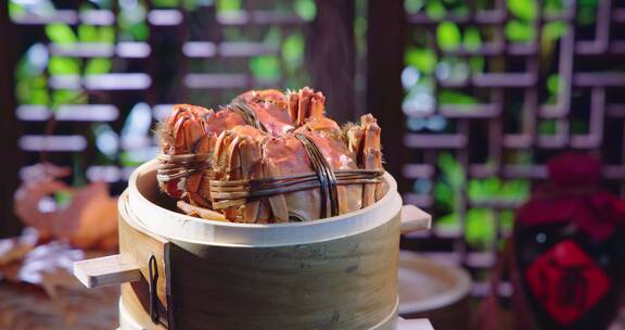 冒着蒸汽的蒸笼里面的中秋节美食大闸蟹螃蟹