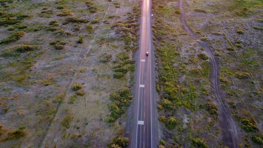 航拍行驶在笔直公路上的货车