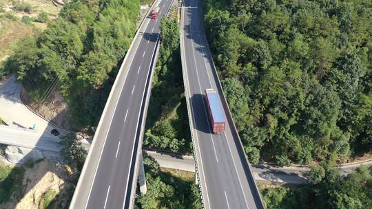 航拍高速公路上行驶的货车汽车高架桥高速路视频素材模板下载