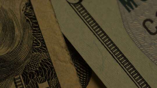 美国鹰盾背景上美国纸币的旋转镜头-MONEY 0415