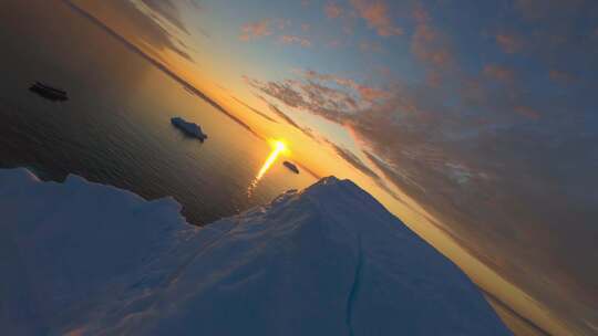 FPV航拍冰山冰川日出阳光照射大海冰川