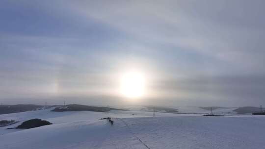 航拍东北雪域雪原日晕视频素材模板下载