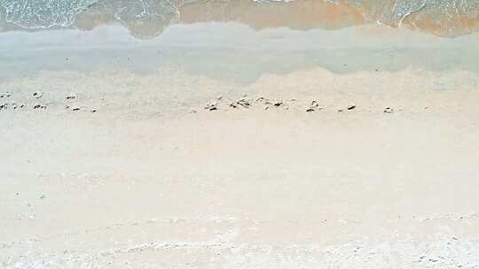 航拍海南三亚湾海边沙滩度假人群