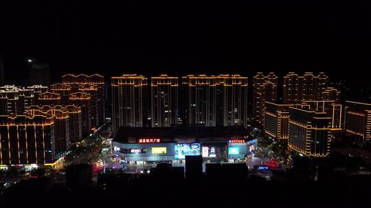 城镇小区广场夜景航拍城市夜景楼房住宅小区