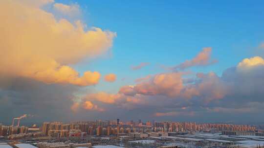 冬季航拍烟台大雪后的城市建筑和晚霞风景