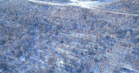 航拍大兴安岭冬季山岭雪林