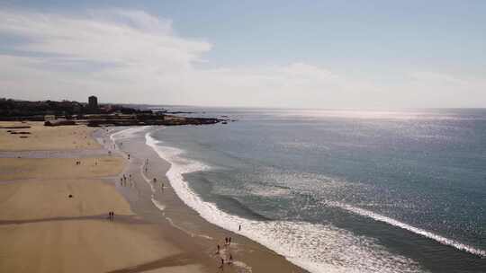 航拍人群海边游玩海浪冲击海滩沙滩日出日落