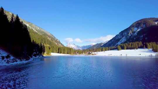 航拍雪山雪景森林湖泊阿尔卑斯维尔萨尔普湖