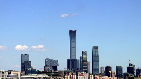 延时北京城市中国尊建筑群及上空移动的云