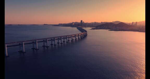 大连航拍海边跨海湾大桥唯美岩壁大海夕阳